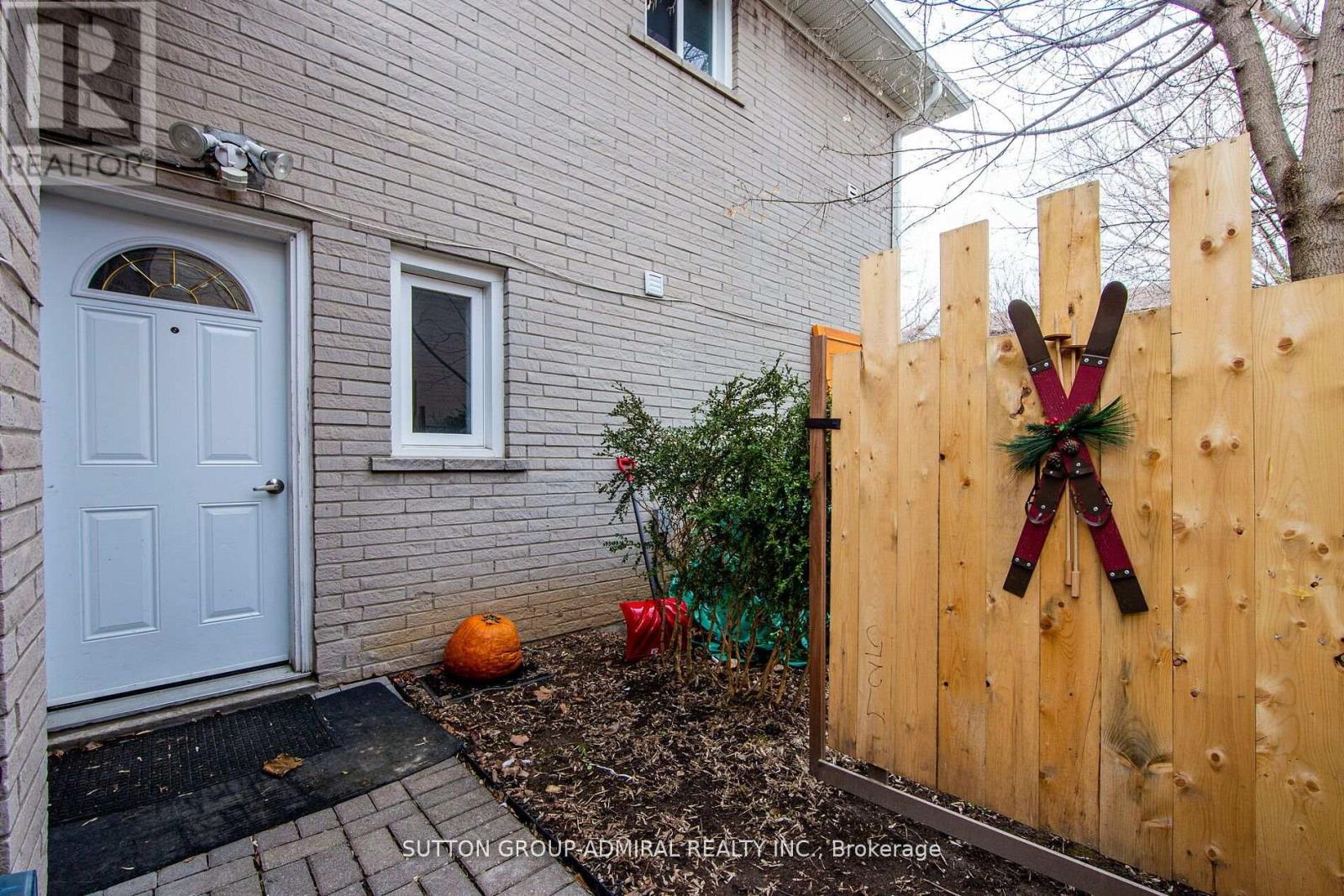 A wooden fence with a decorative X on it.
