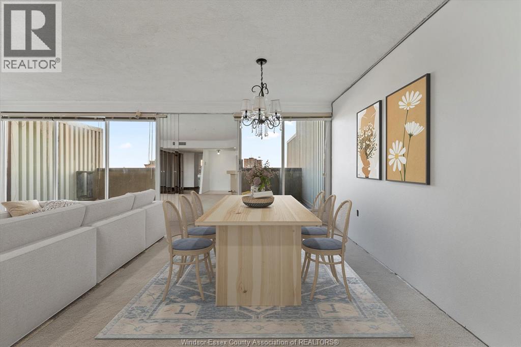 A dining room with a wooden table and chairs.