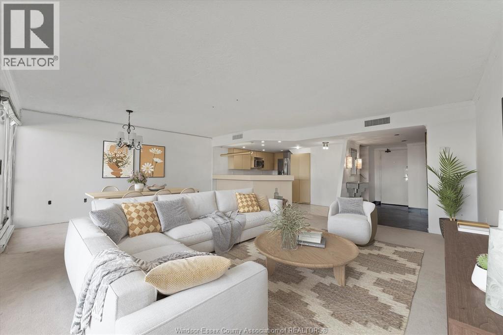 A living room with a white couch and a coffee table.