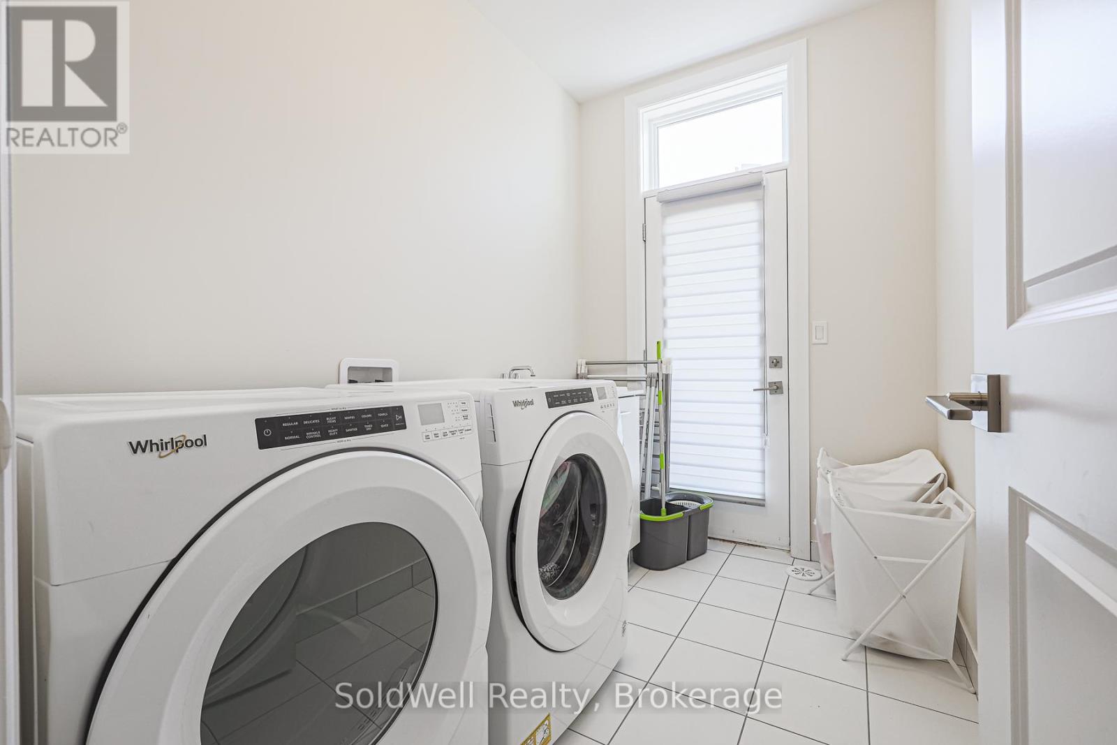 A laundry room with a washer and dryer from Whirlpool.