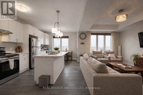 A modern kitchen with white cabinets and a large island.