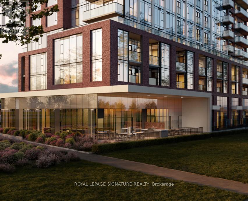 A modern building with a grassy area in front of it.