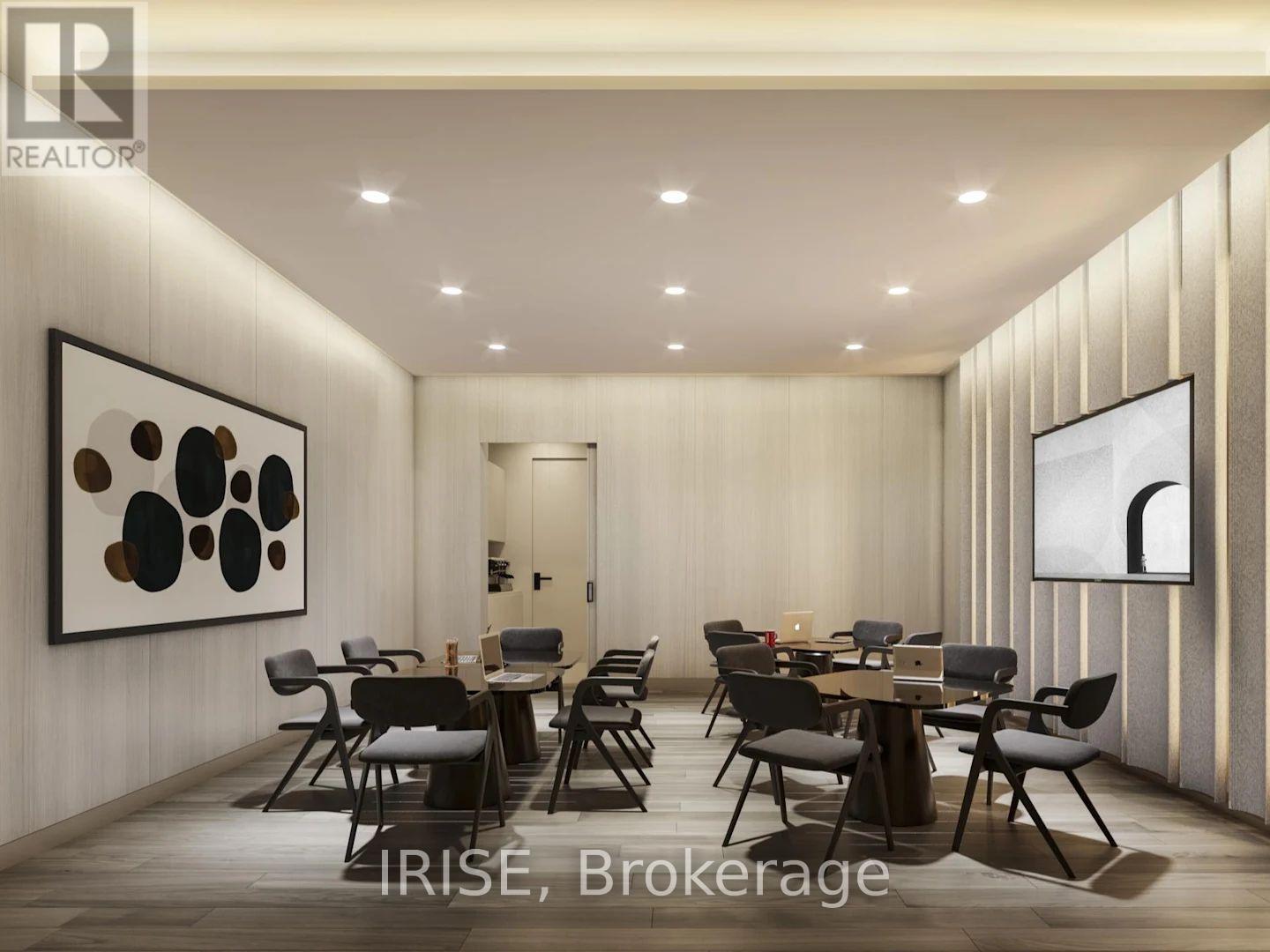 A modern dining room with a large table and chairs.