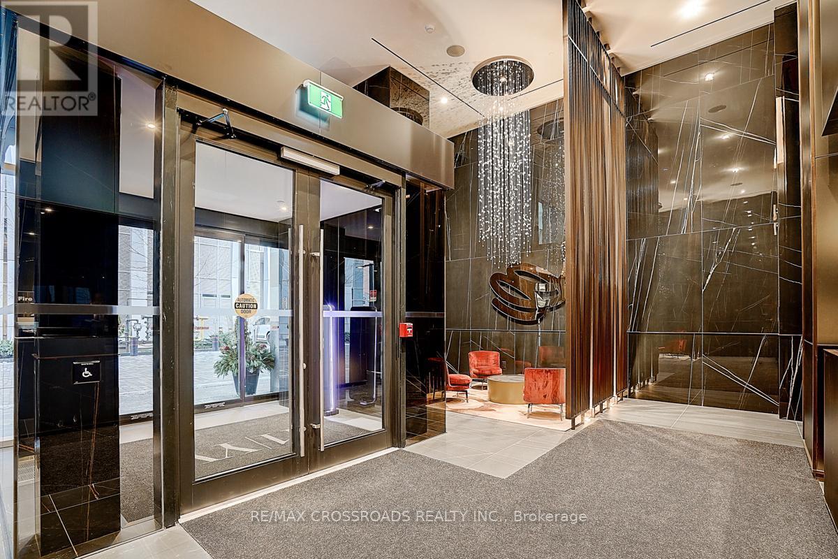 A glass door with a metal frame and a sign that says "EXIT" above it.