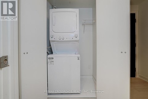 A white dishwasher is installed in a small kitchen.