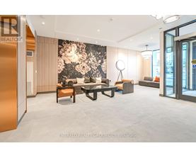 A modern living room with a large floral wallpaper and a variety of seating options.