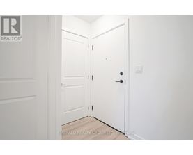 A white door is open to a hallway.