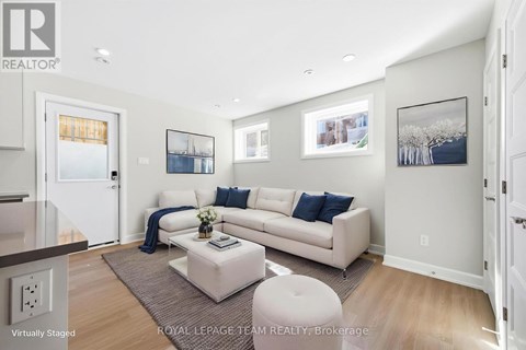 A living room with a white couch and a coffee table.