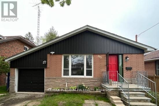 A house with a red door is for sale.