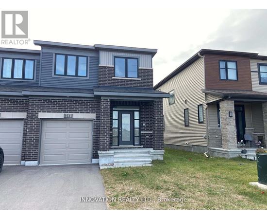 A house with a grey garage door is for sale.