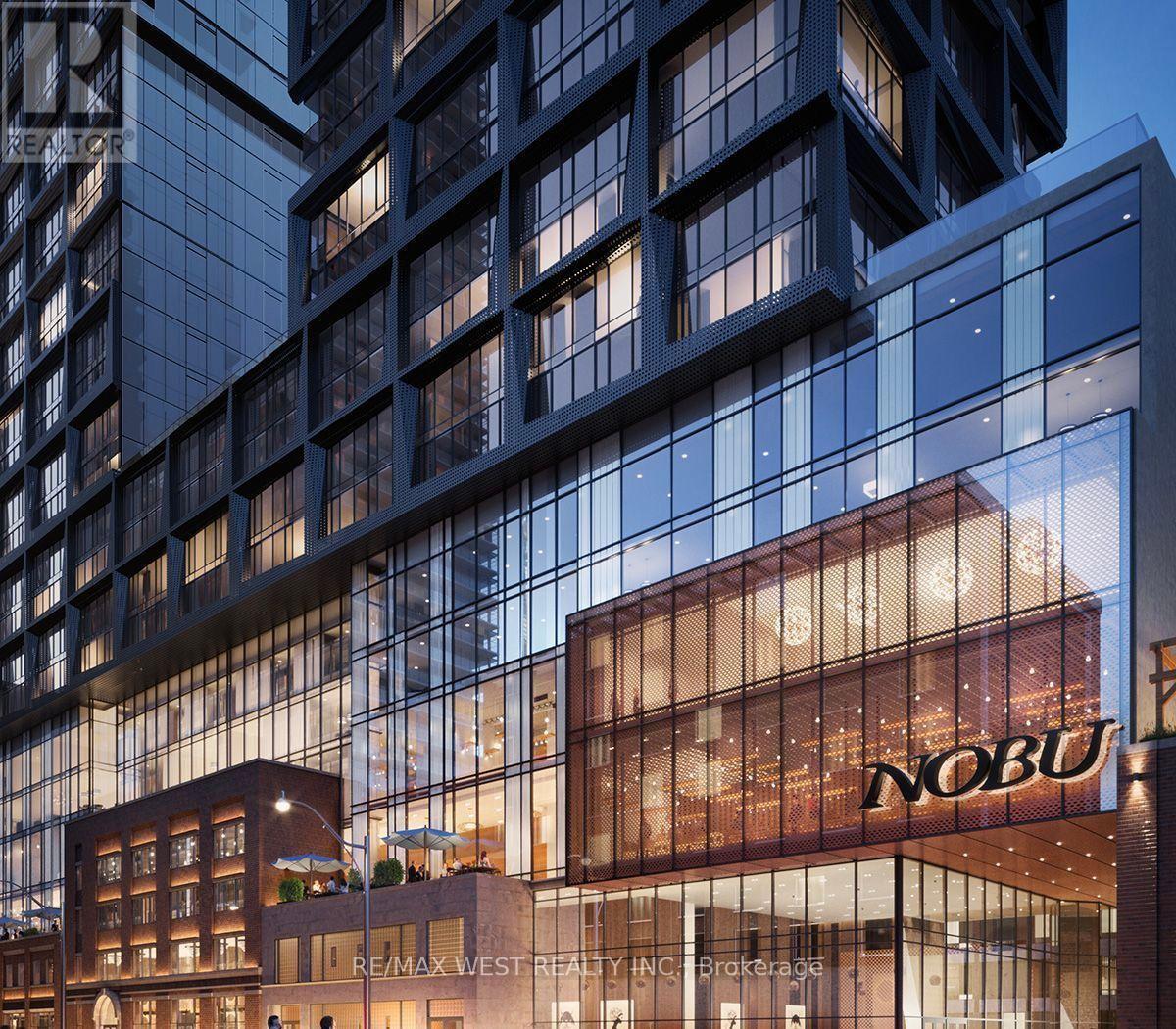 The exterior of a modern building with the sign "NOBU" on the front.
