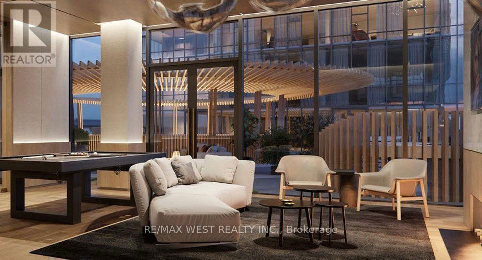 A modern living room with a pool table and comfortable seating.