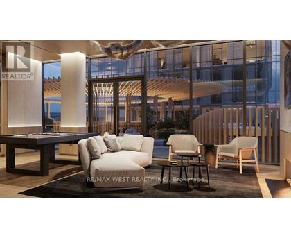 A modern living room with a pool table and comfortable seating.