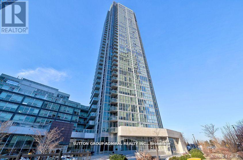 A tall glass building with the text Sutton Group Realty Inc Brokerage on the front.