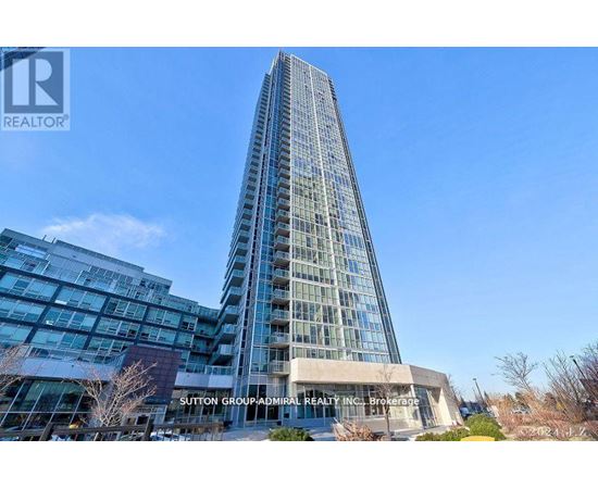 A tall glass building with the text Sutton Group Realty Inc Brokerage on the front.