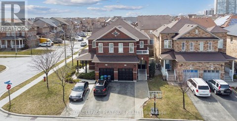 A Royal LePage Platinum Realty sign is on a house in a residential area.