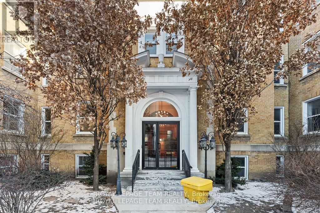 A building with a yellow box in front of it.