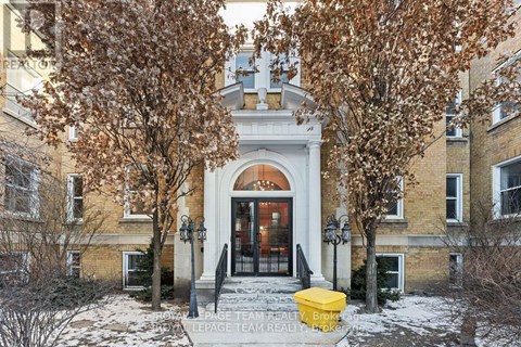 A building with a yellow box in front of it.
