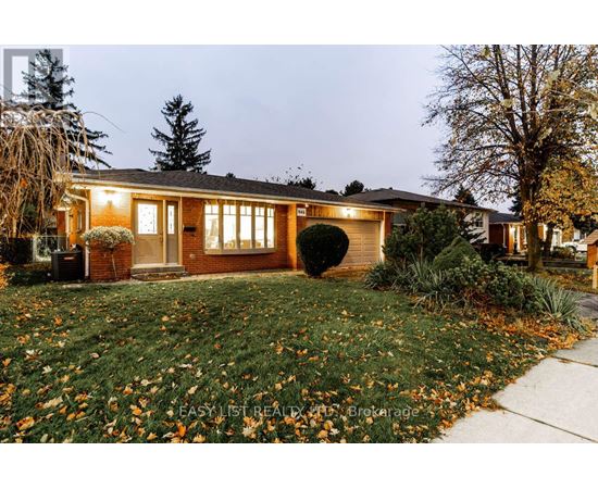 A house with a lawn and trees in front of it.