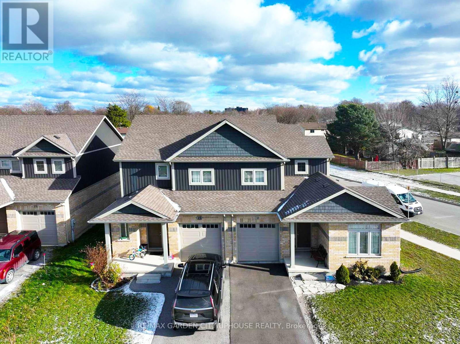 A large house with a carport and a garage is for sale.