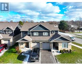 A large house with a carport and a garage is for sale.