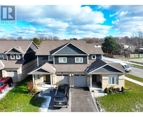 A large house with a carport and a garage is for sale.