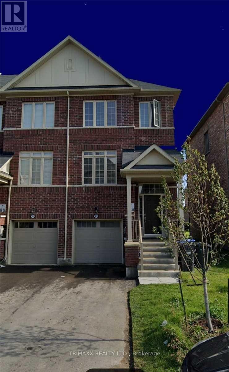 A brick house with a white door and windows.
