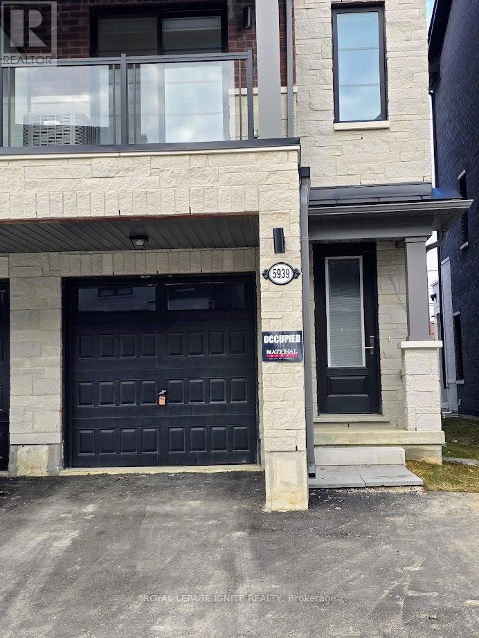 A black door with a sign that says "occiopien" on it.