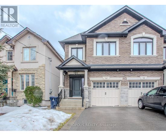 A house with a car parked in front of it.