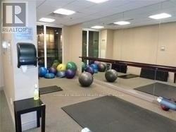 A gym with a sign that says "REALTOR" on the wall.