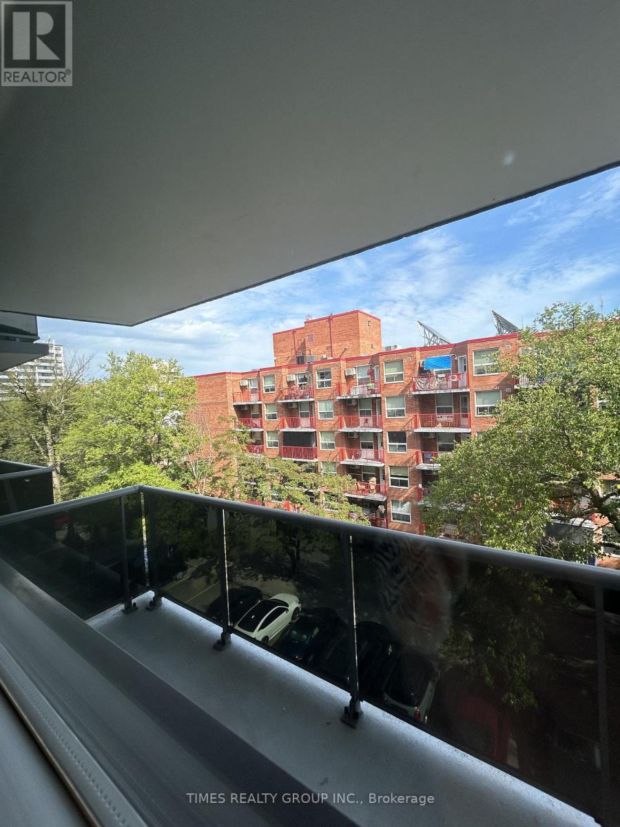 A building with a glass balcony in front of it.