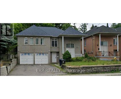 A house with a garage is for sale.