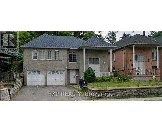 A house with a garage is for sale.