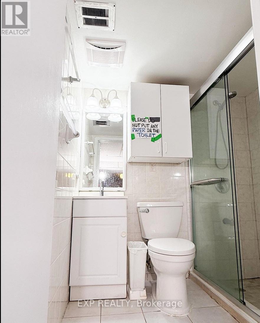 A white toilet with a sign above it that says "Leave no paper in the toilet.".