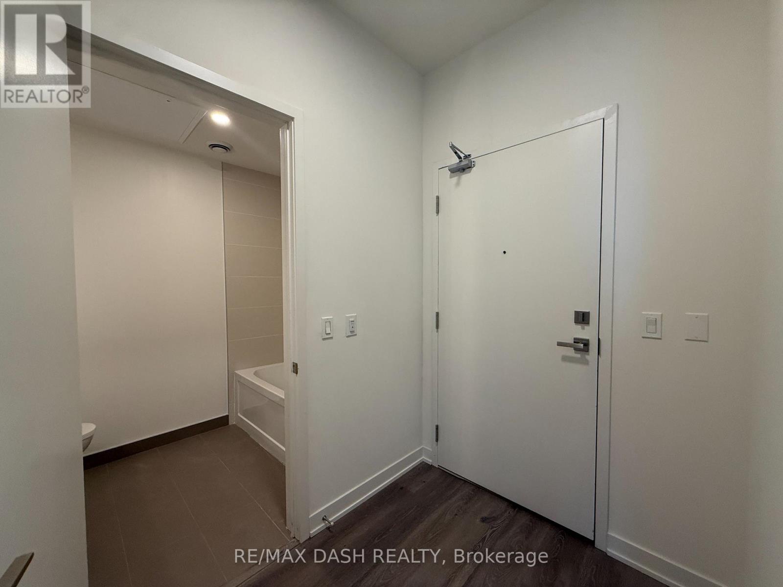 A white bathroom with a walk in shower.