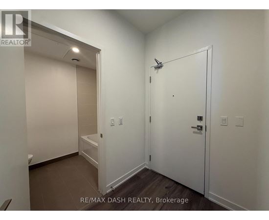 A white bathroom with a walk in shower.