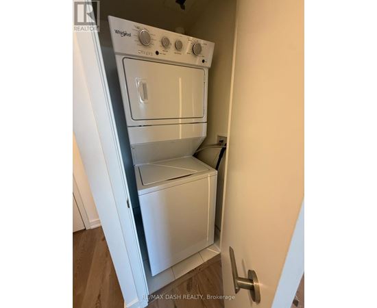 A white Whirlpool oven and microwave are installed in a kitchen.