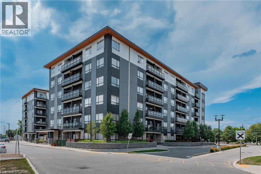 A modern apartment building with a clear sky in the background.