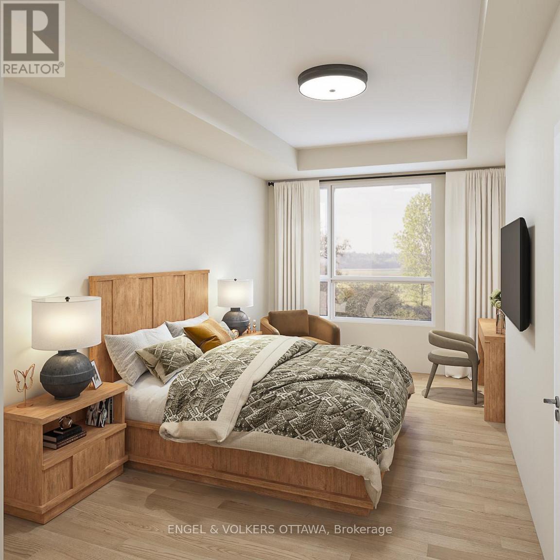 A bedroom with a bed, nightstand, and chair.