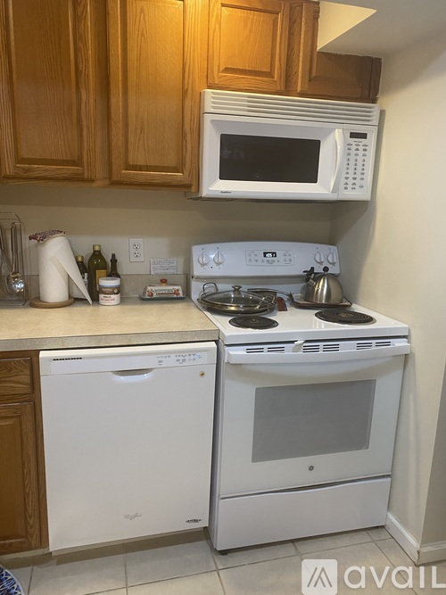 A white oven and microwave in a kitchen.