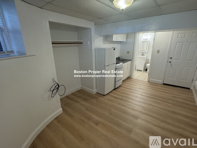 A kitchen area with a refrigerator, stove, and oven.