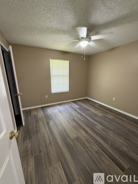 A kitchen with wooden cabinets and white appliances.