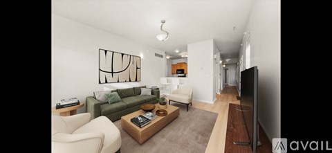 A living room with a green couch and a television.