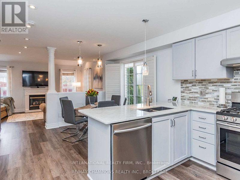 A modern kitchen with white cabinets and a large island.