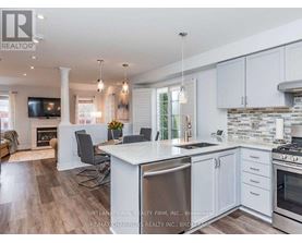 A modern kitchen with white cabinets and a large island.