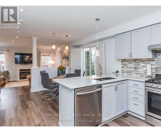 A modern kitchen with white cabinets and a large island.