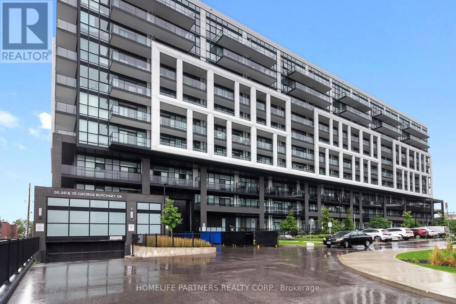 A modern building with the sign "HOMELIFE PARTNERS REALTY CORP. Brokerage" in front of it.