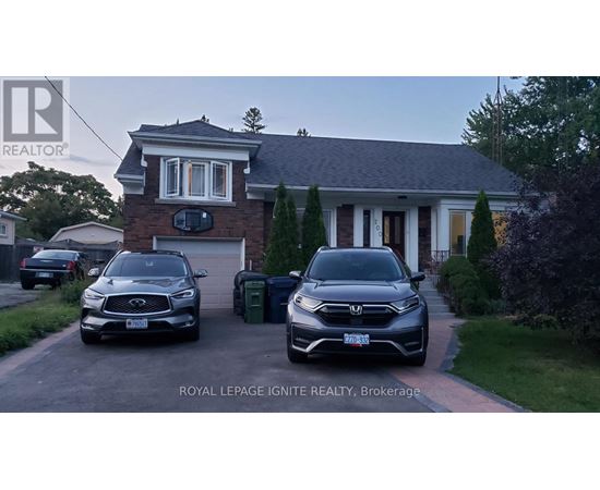 Two cars are parked in front of a house with the text "ROYAL LEPAGE IGNITE REALTY, Brokerage" on the image.
