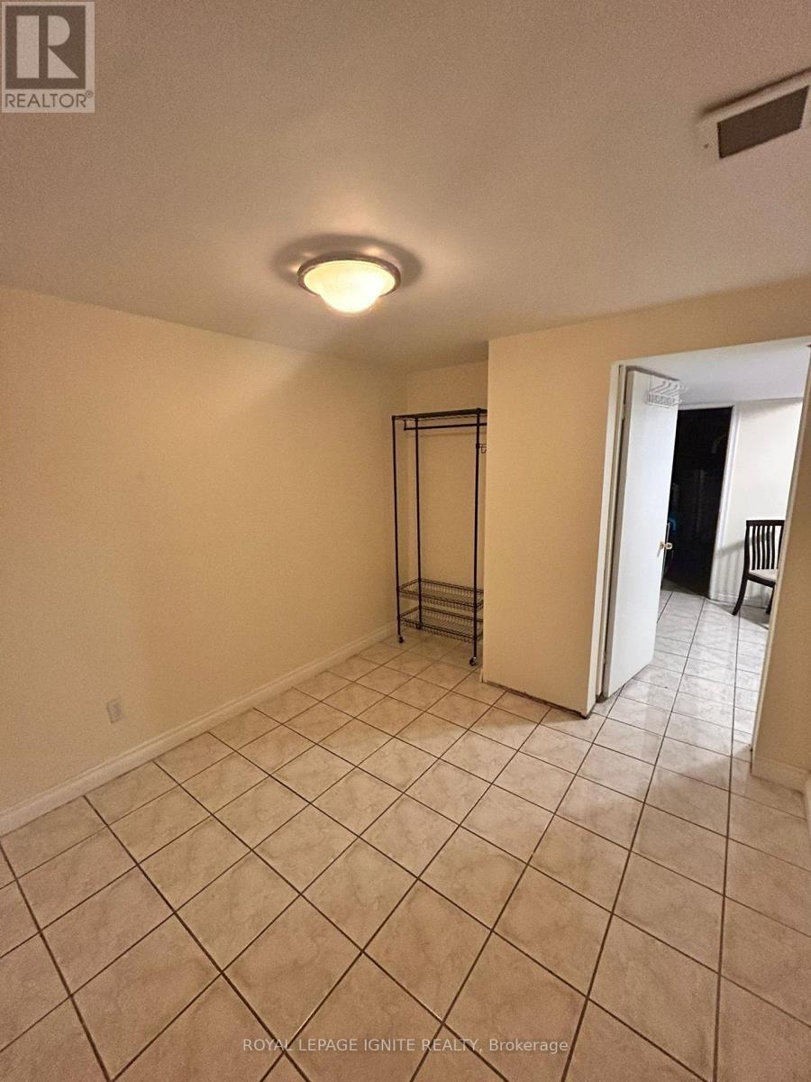 A room with a tiled floor and a sliding door.