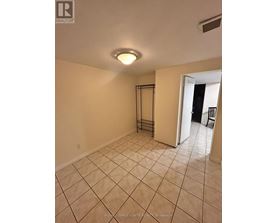 A room with a tiled floor and a sliding door.